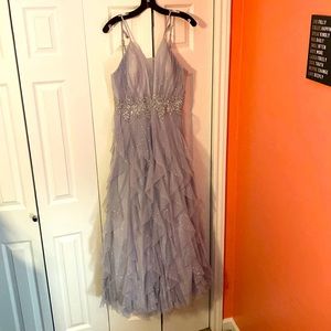 Gorgeous glittery silver dress with purple undertone. Perfect for prom.